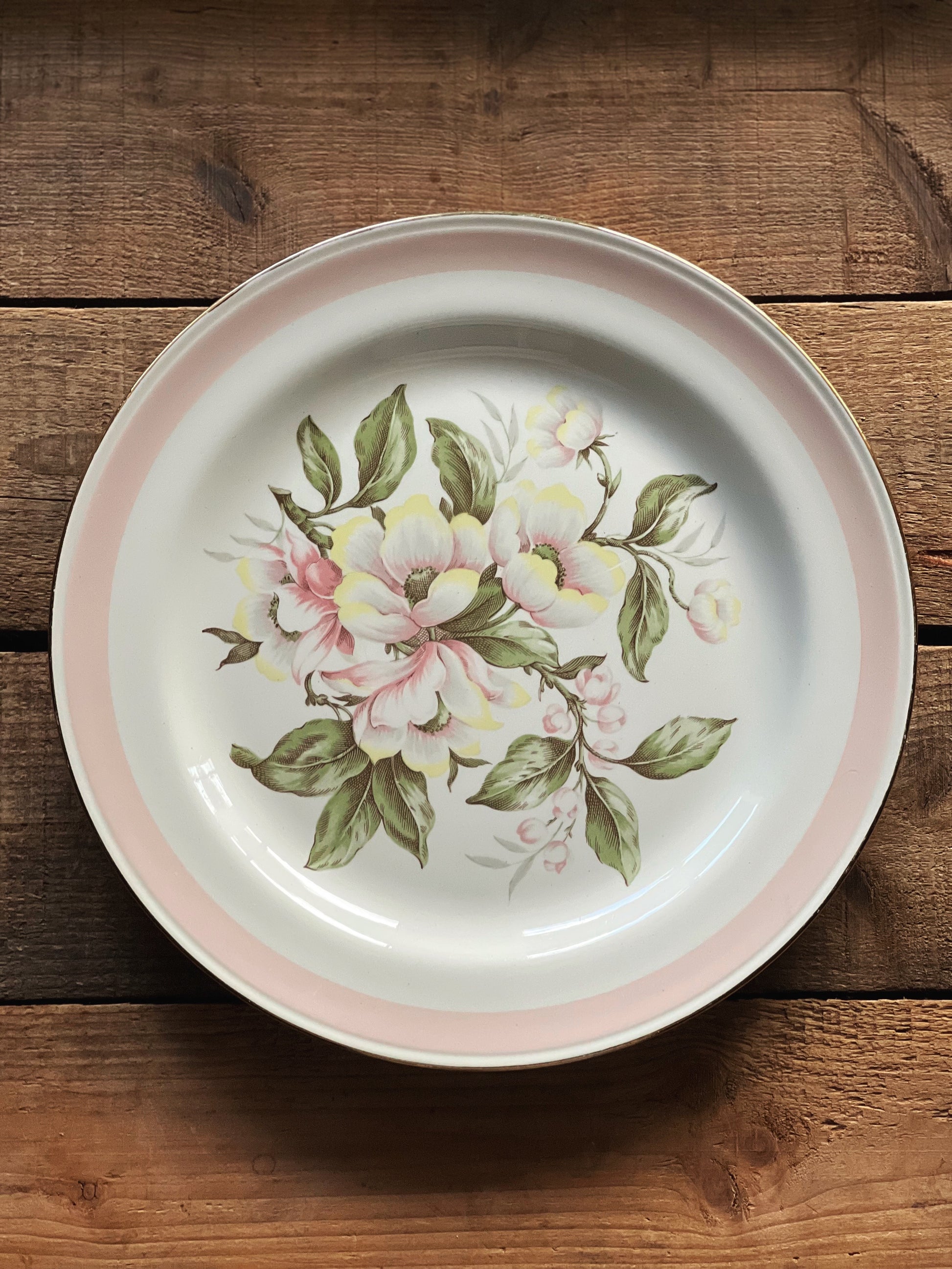 Floral-patterned plate on a wooden surface