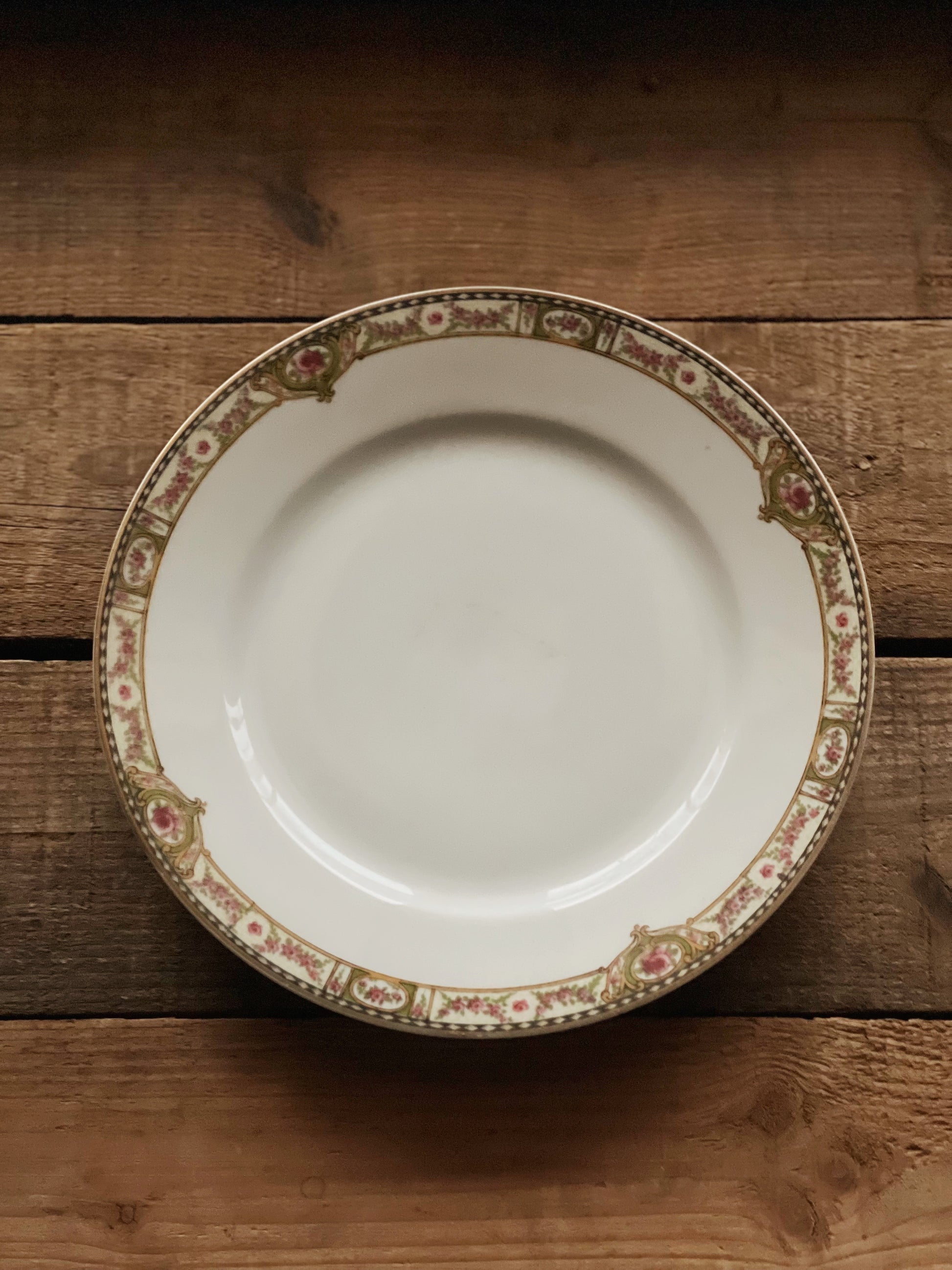 Limoge salad plate with pink roses and a green and black rim design