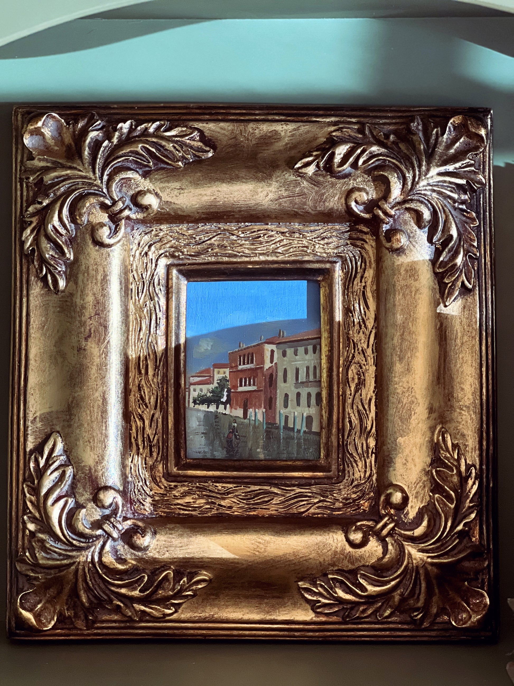 small oil painting in a gold gilt frame