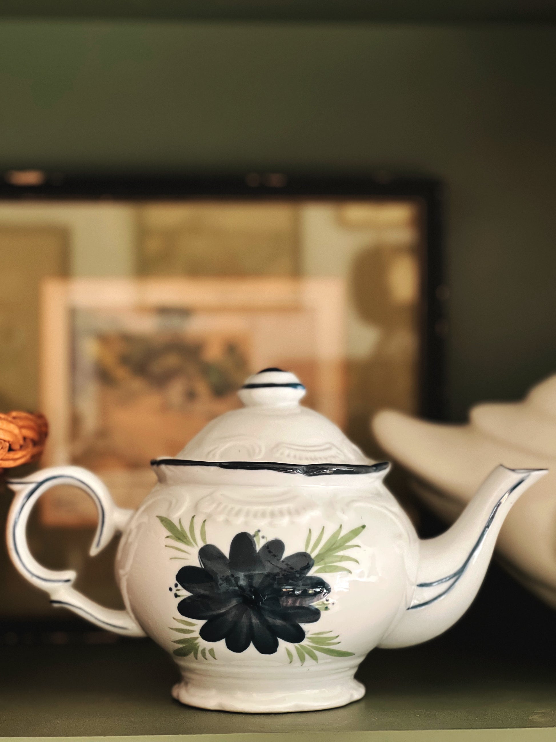 individual size teapot with a navy floral design