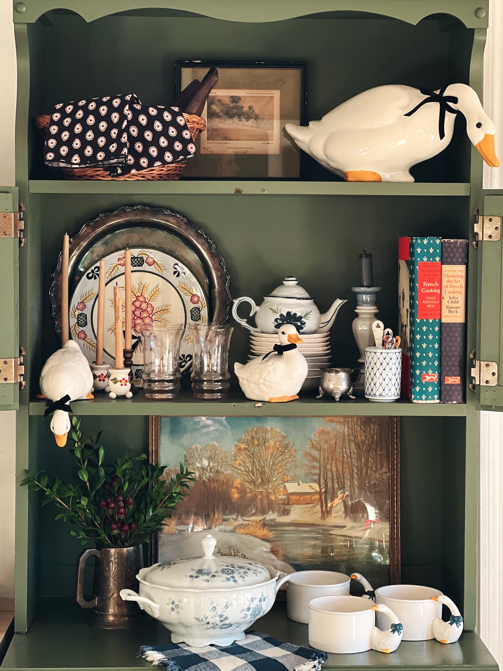 Kitchen cupboard full of country decor