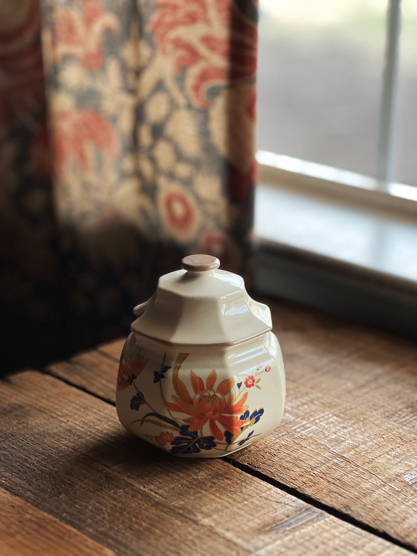 sugar bowl with navy and orange chrysanthemums