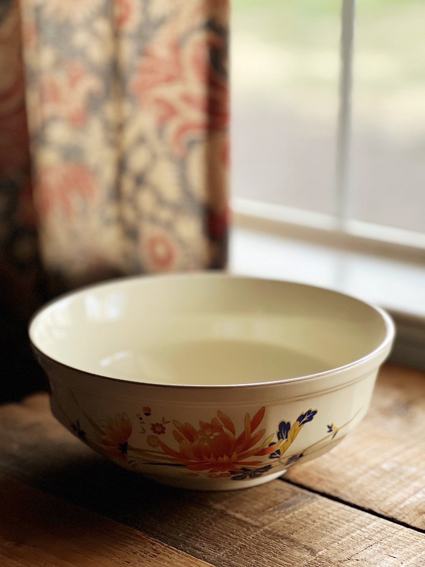 serving bowl with navy and orange chrysanthemum design