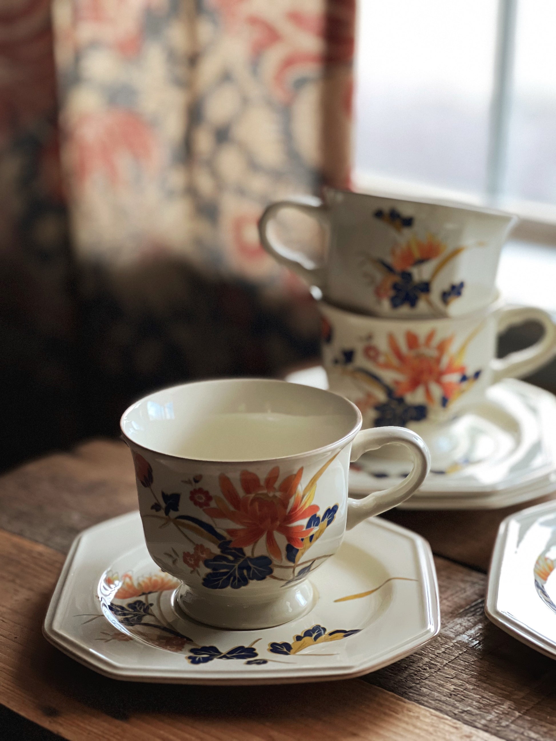 navy and orange teacup and saucer set