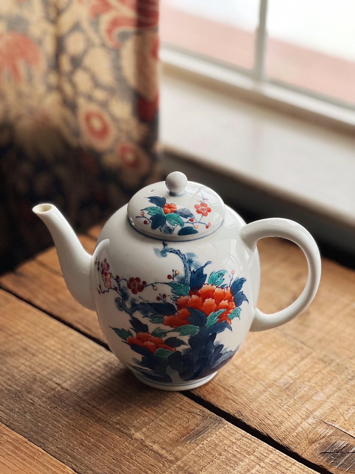 navy and red porcelain teapot