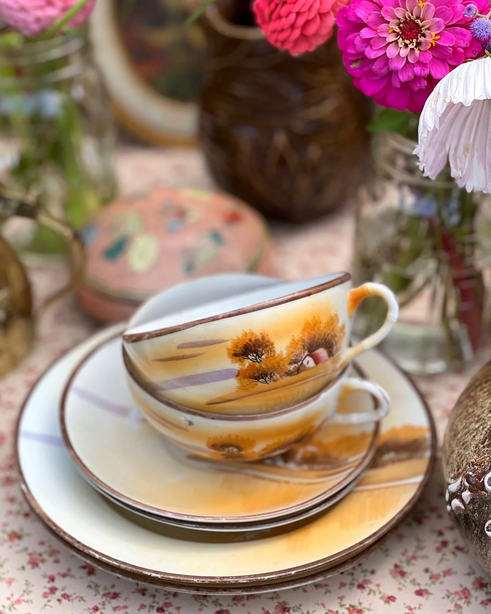 pair of hand painted teacups and saucers and plate set