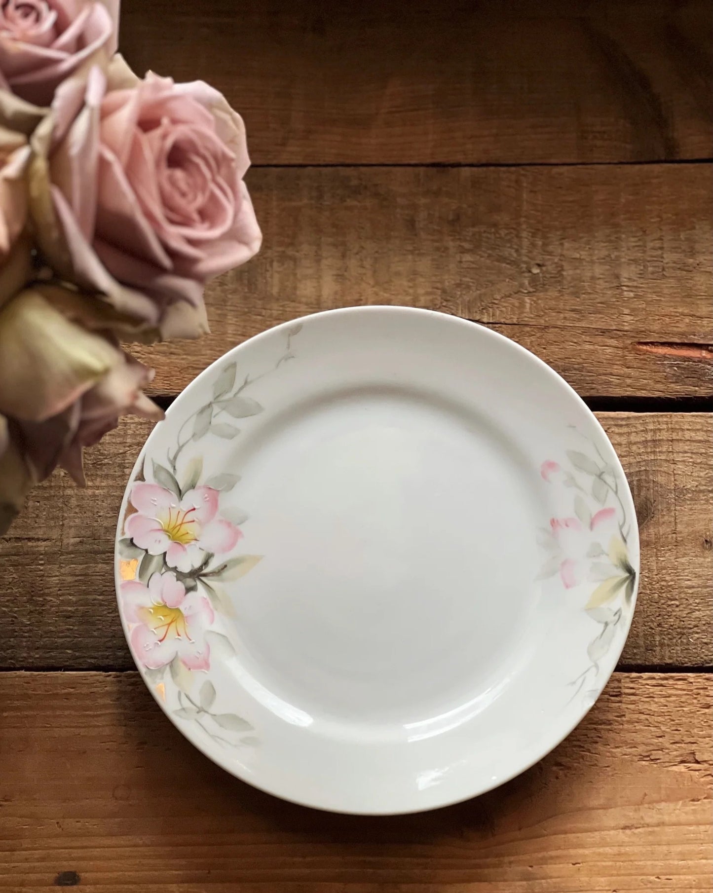 hand painted white plate with pink and gray flowers