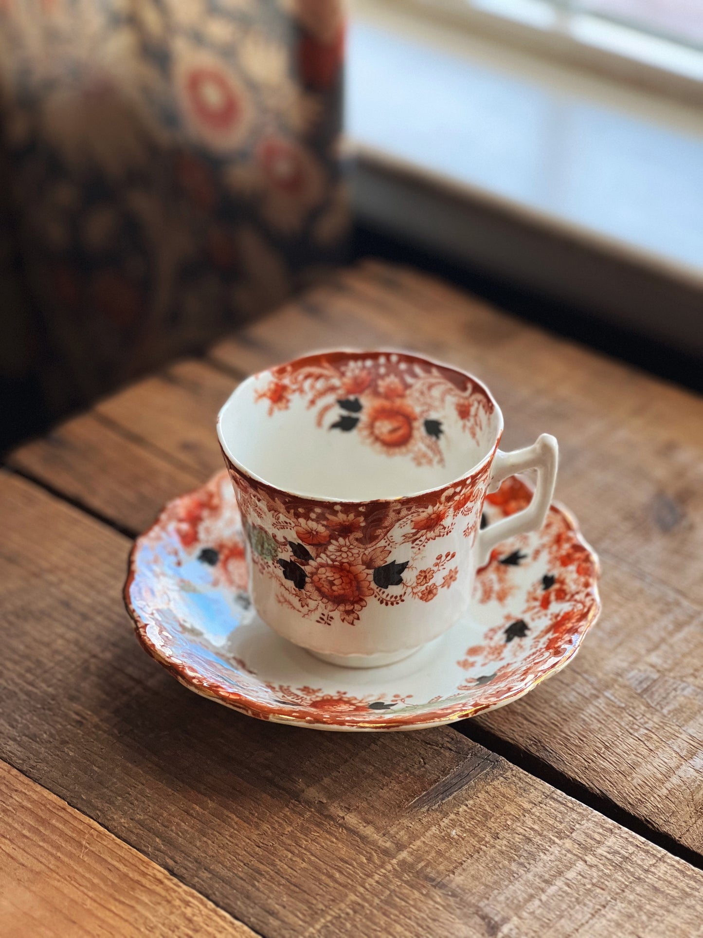 navy and red floral teacup and saucer set