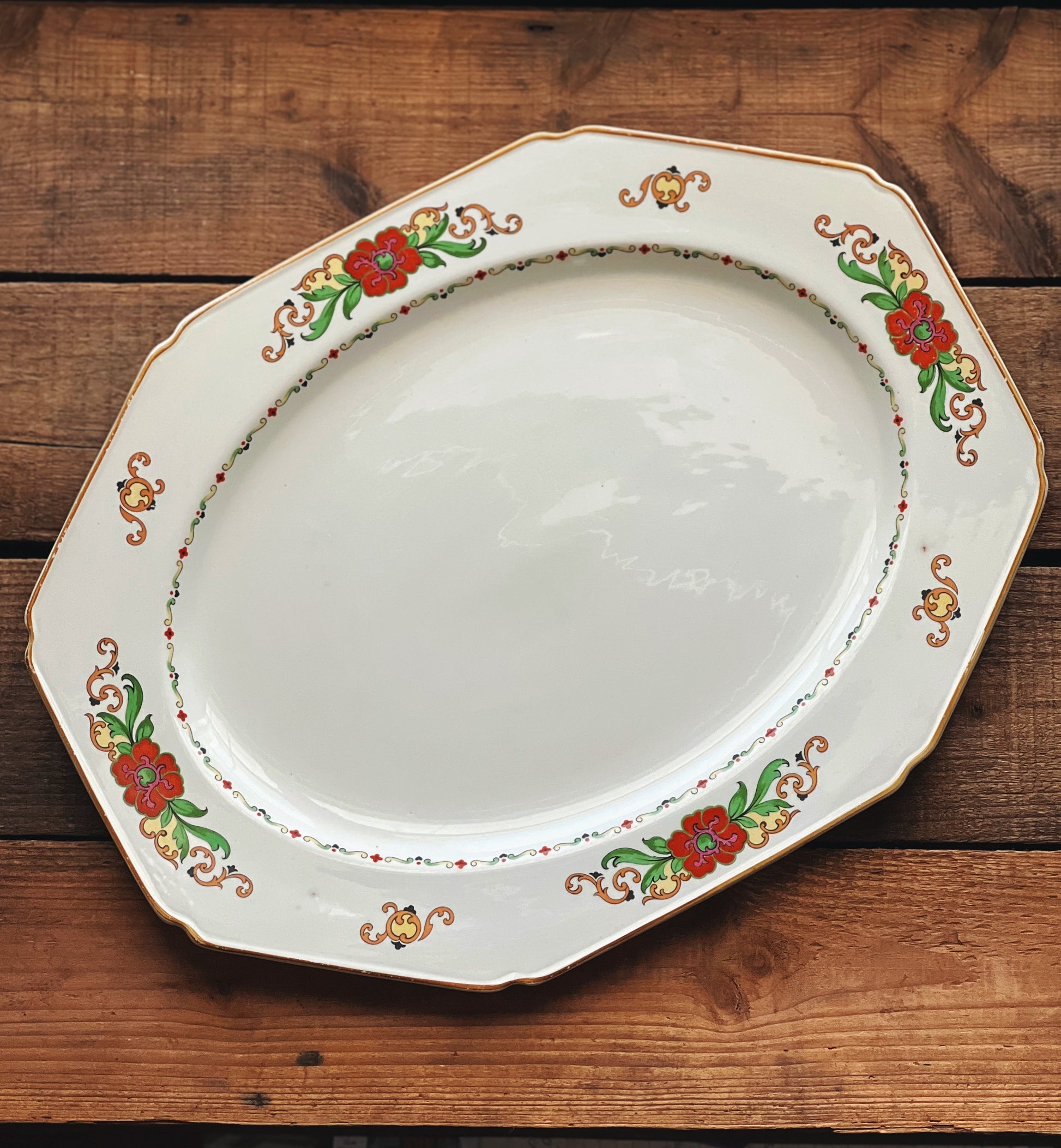 octagonal shape platter with red, yellow and green floral design