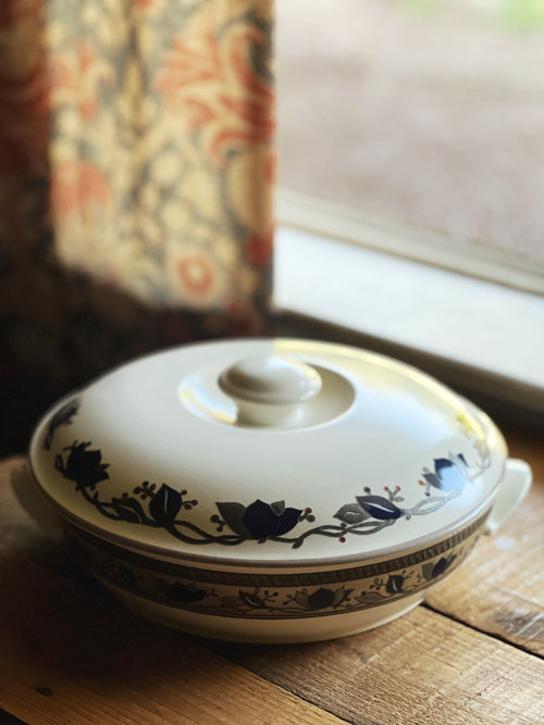 Ceramic dish with blue floral patterns on a wooden surface