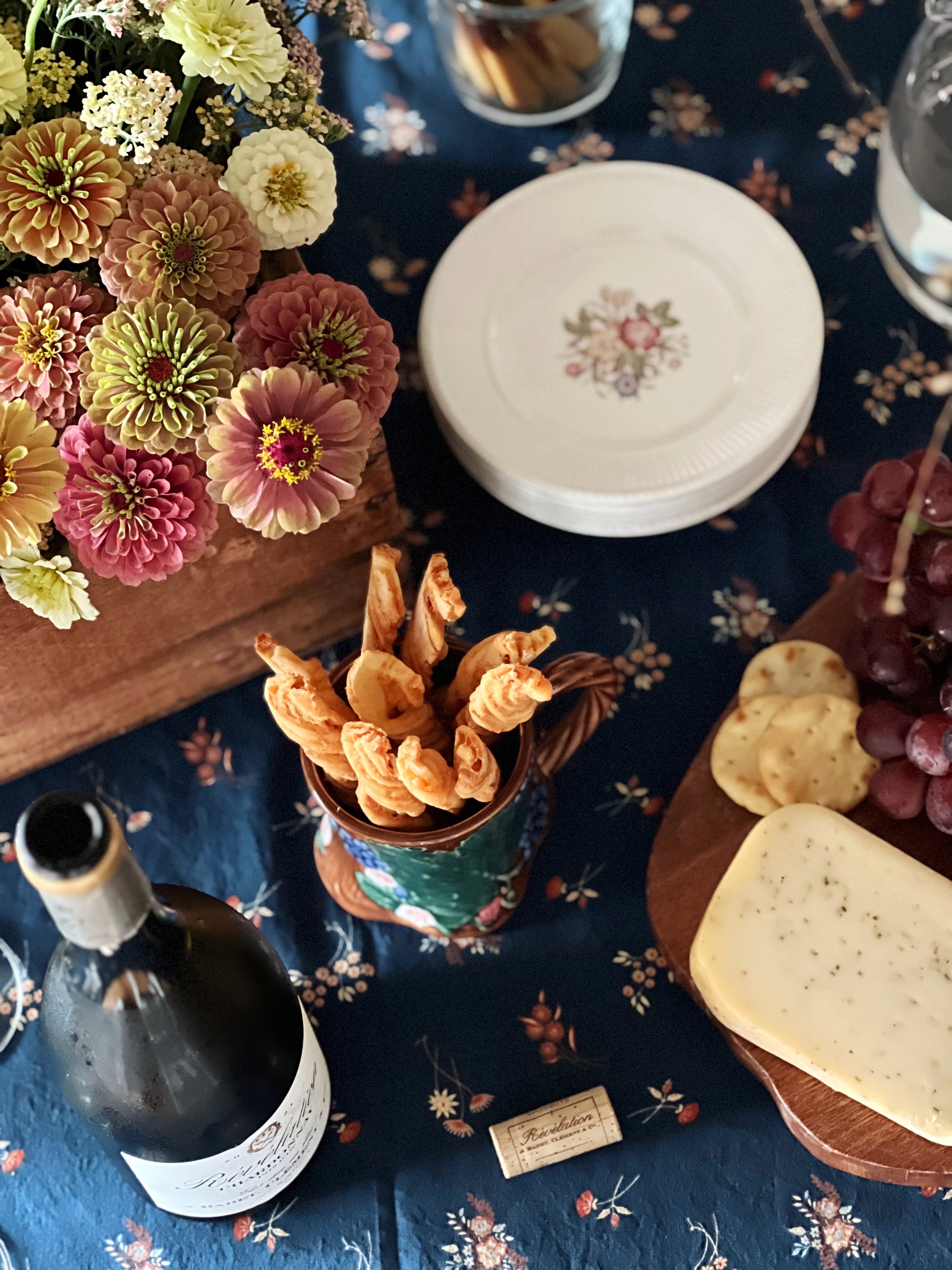 floral dessert plates on a table with charcuterie