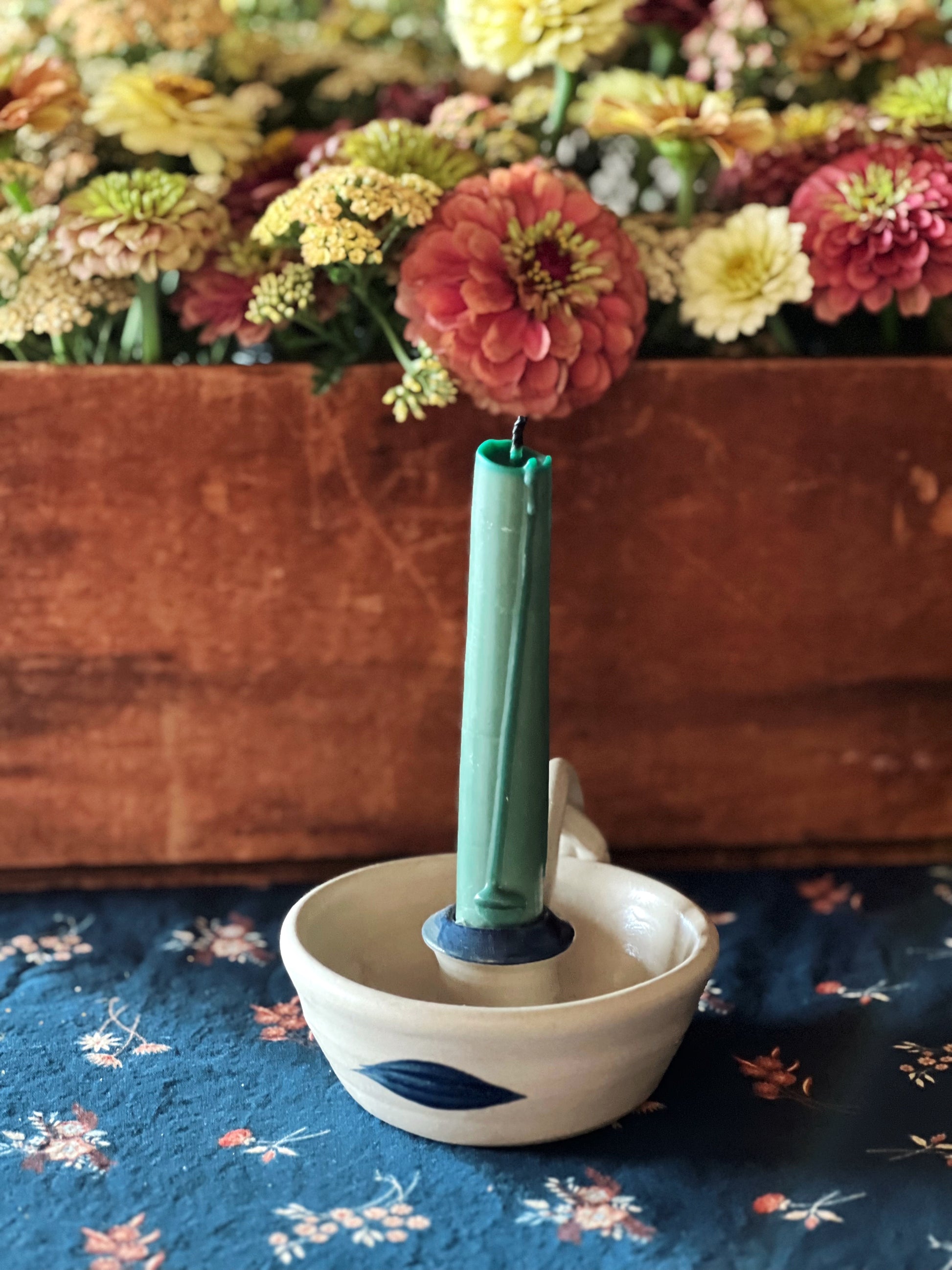 stoneware candle ring with hand painted navy blue accents