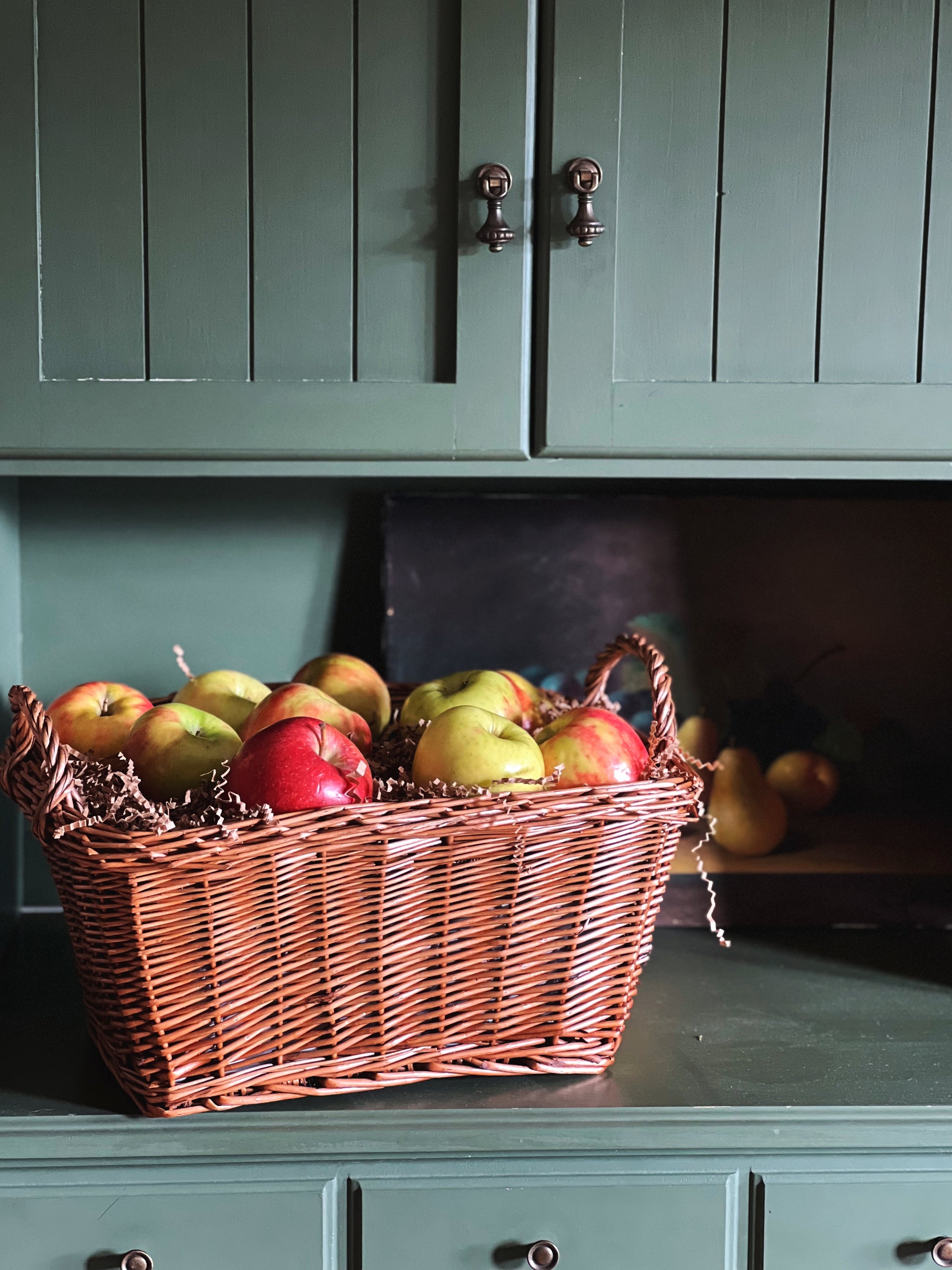 vintage picnic basket full of apples