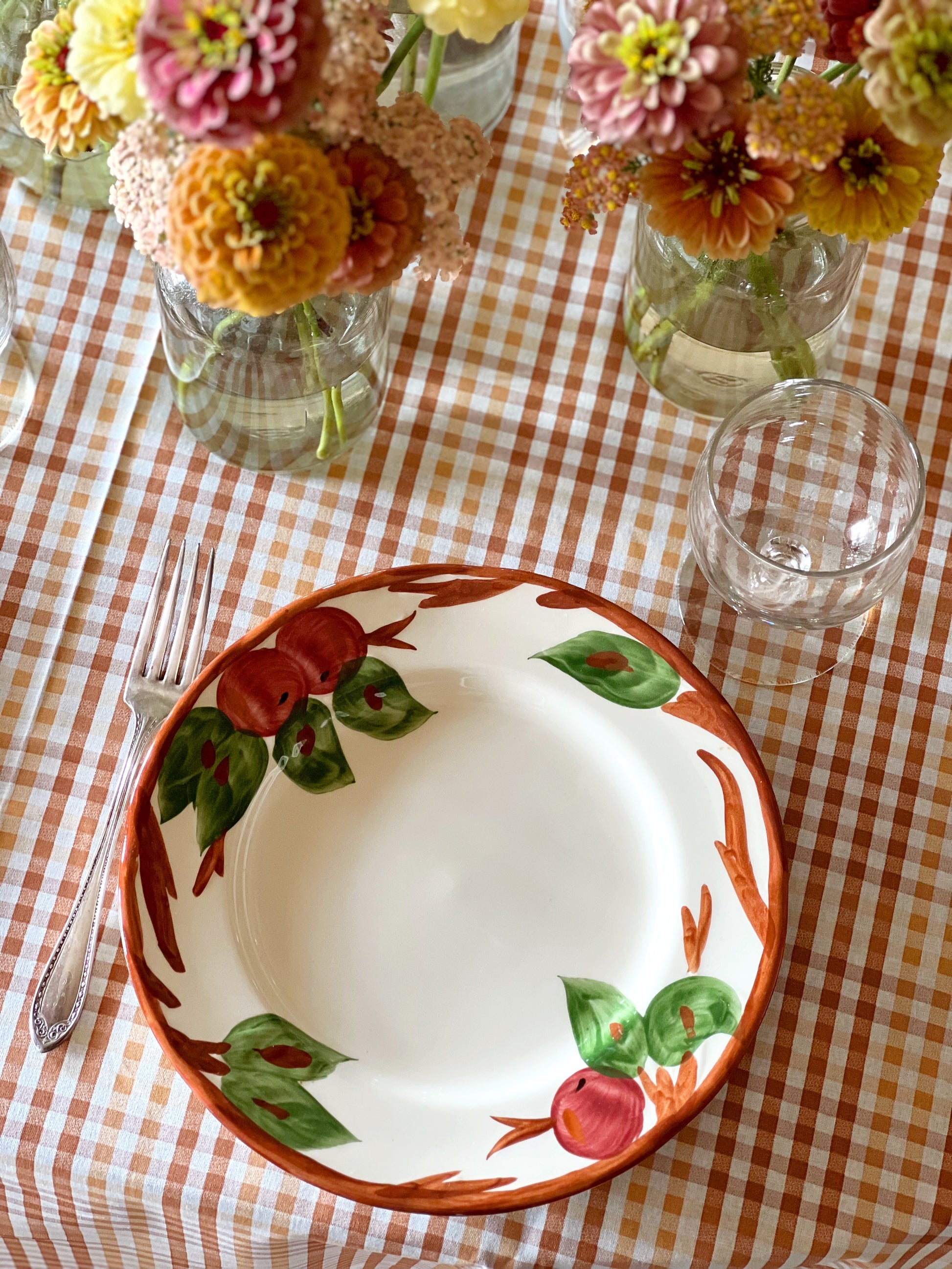 Franciscan Apple plate on a table with a gingham tablecloth