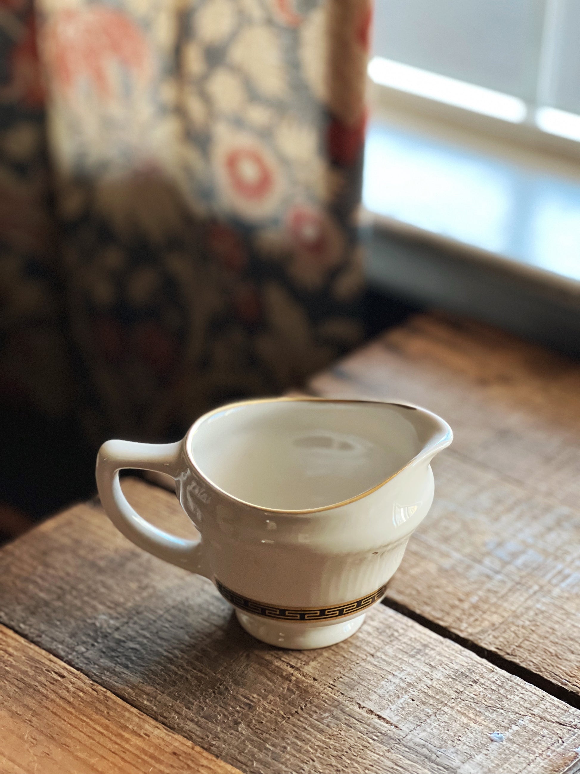 black ivory and gold creamer by Sterling China