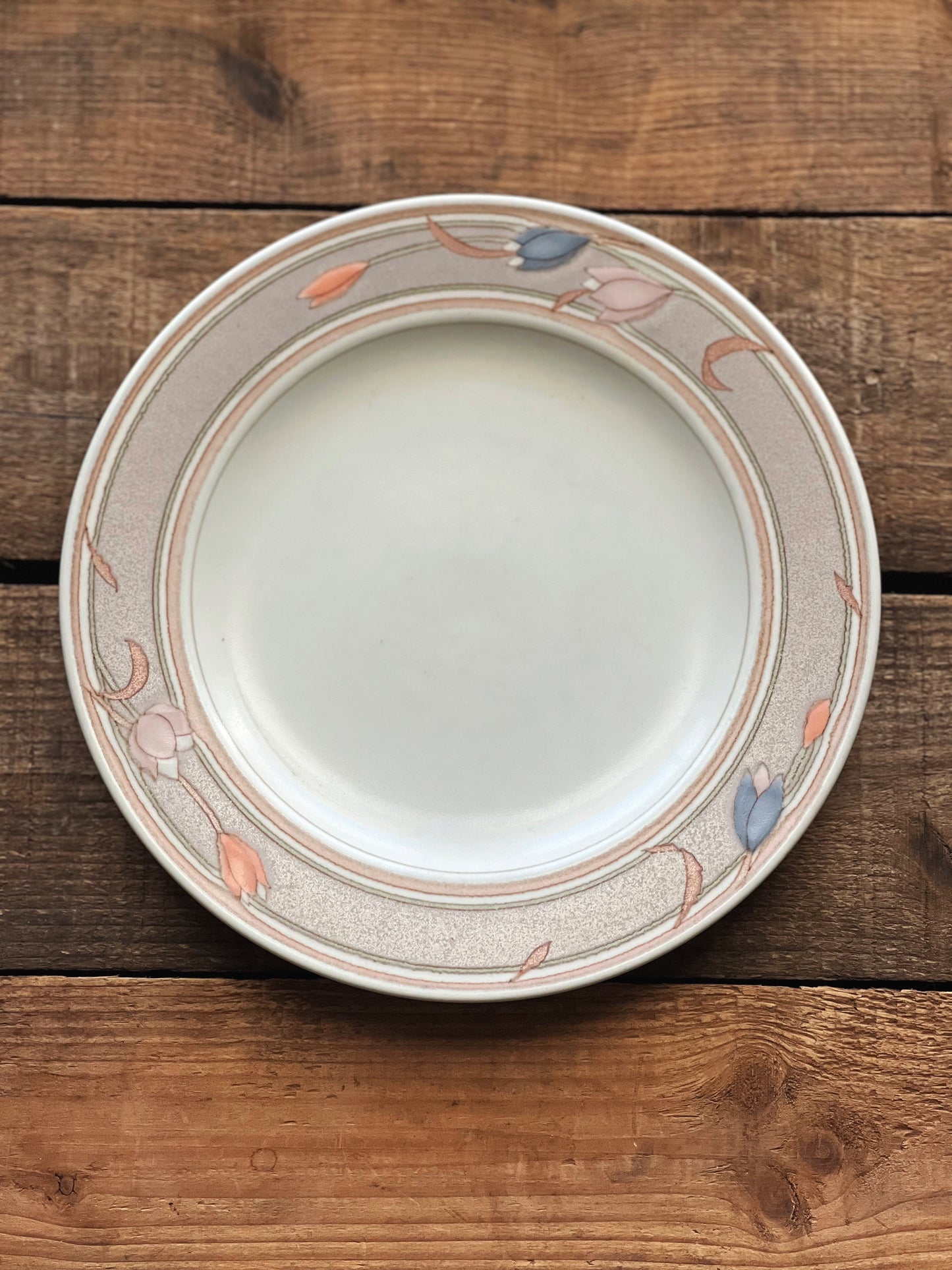 salad plate with a soft brown band and pink, peach and blue flowers