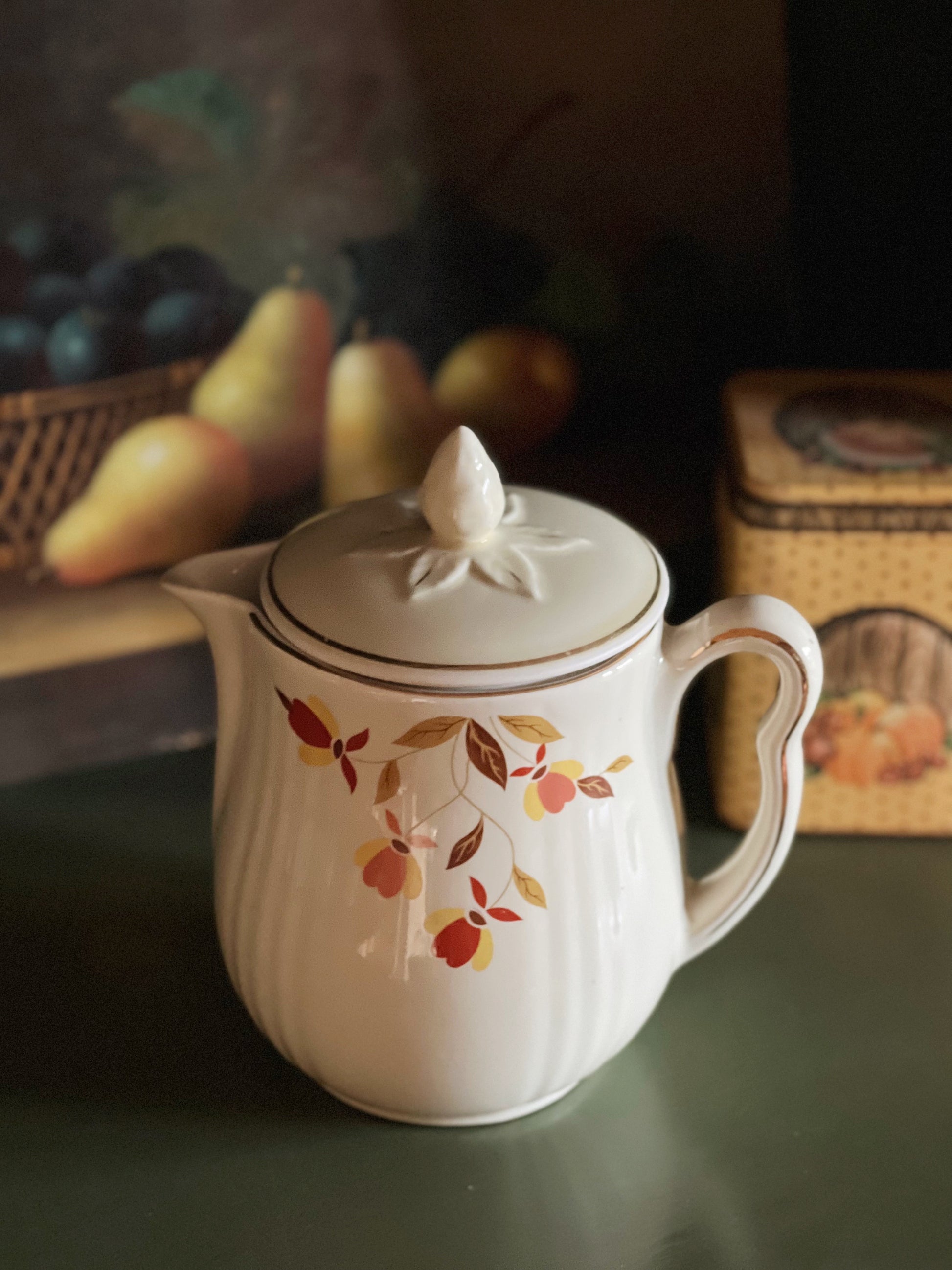 vintage teapot with an autumn leaves design