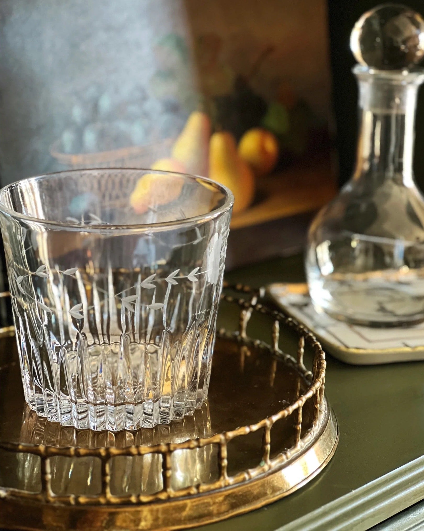 clear glass ice bucket with an etched design