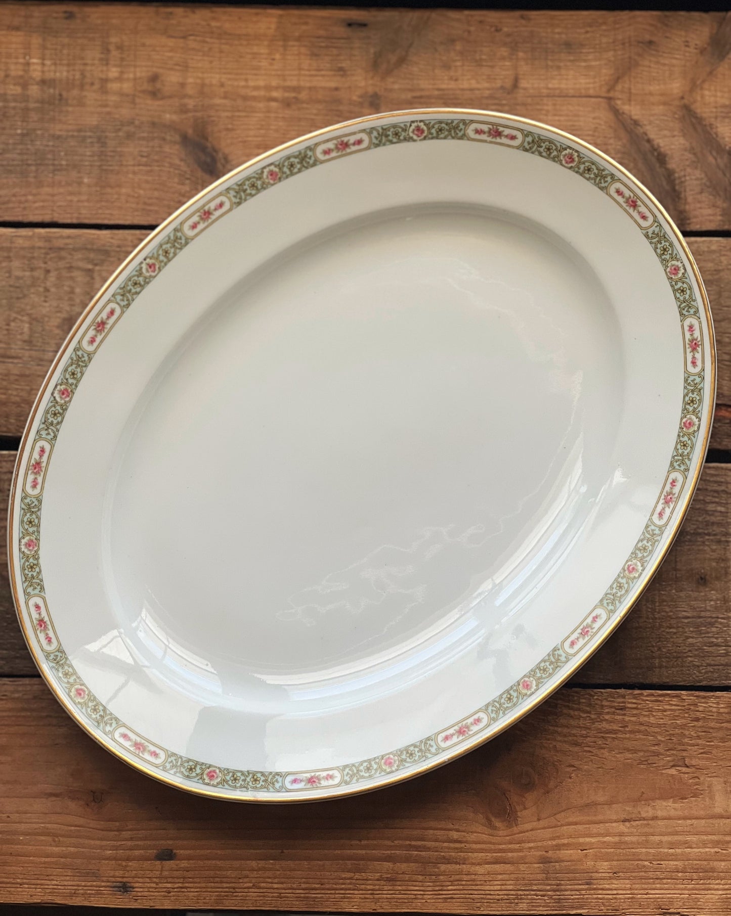 Limoges serving platter with a green and pink rim