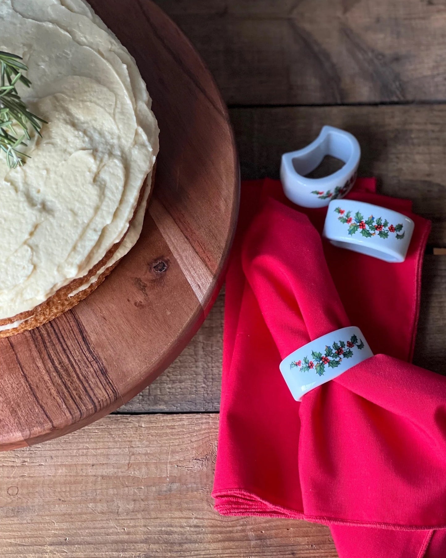 white ceramic napkin rings with red and green holly leaves 