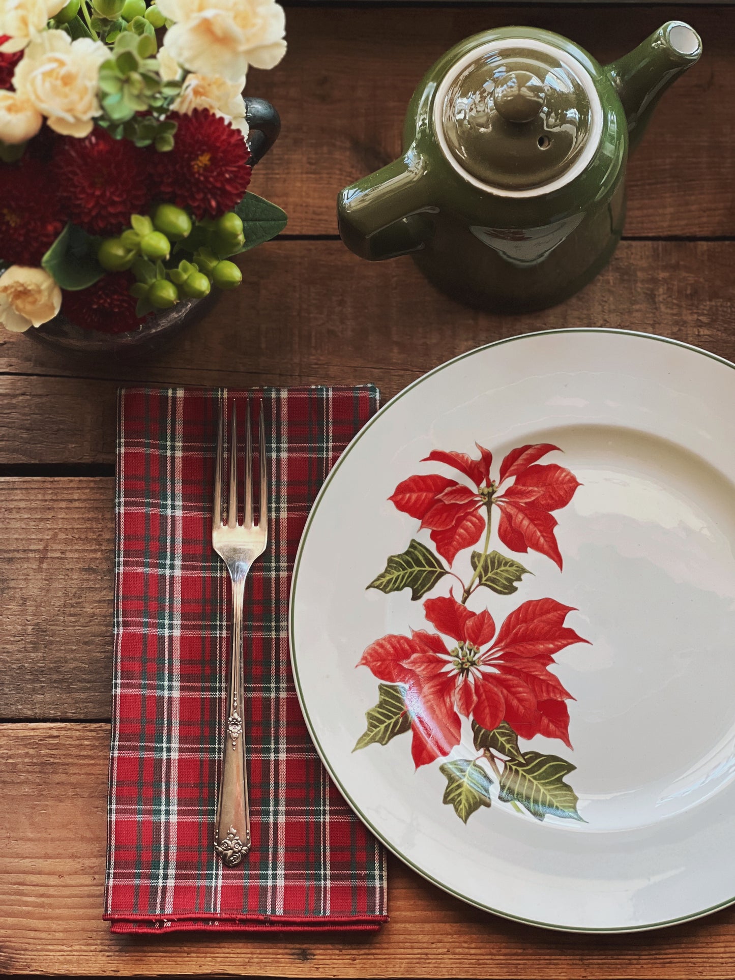 red plaid napkins on a table set for Christmas