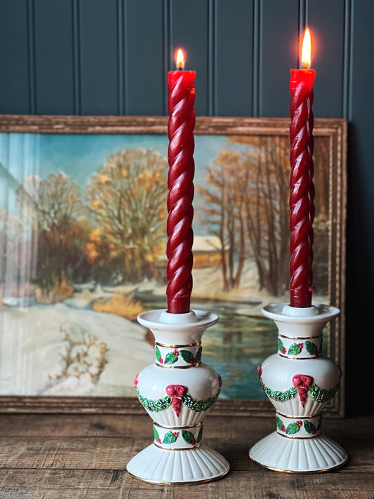 ceramic candleholders with bows and garlands