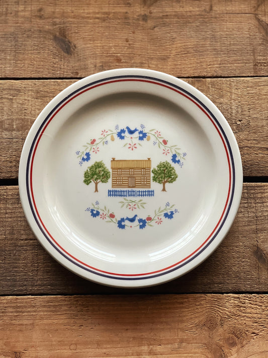 stoneware salad plate with a house design