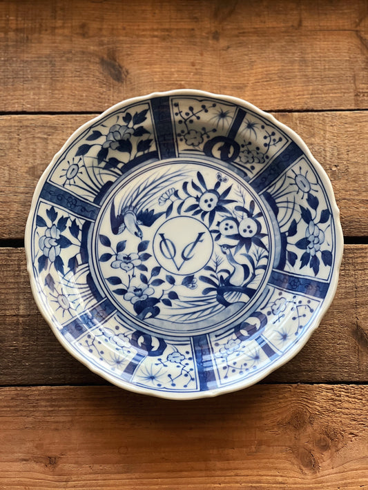 blue and white vintage porcelain plate with a chinoiserie design