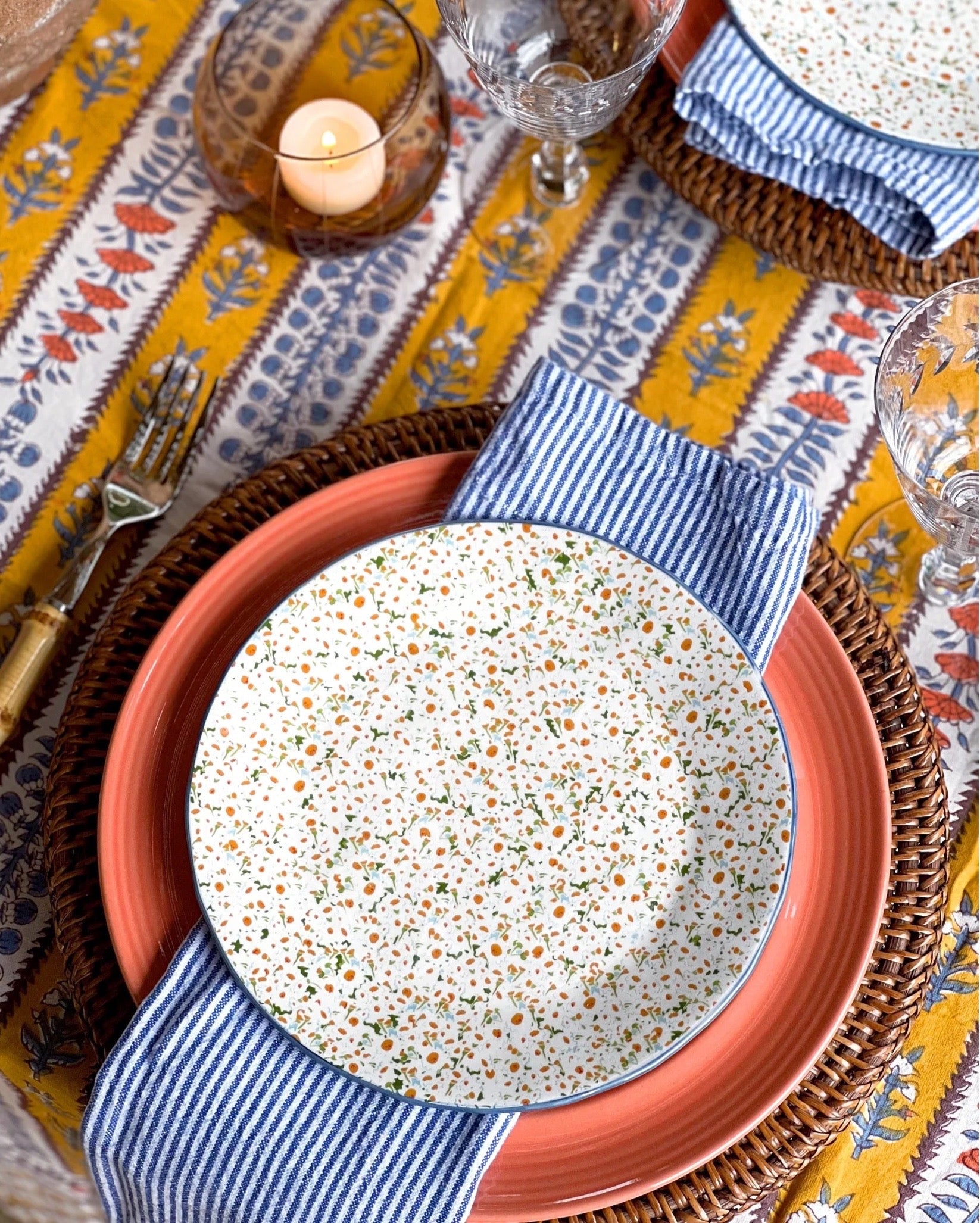 pink dinner plate on a layered table