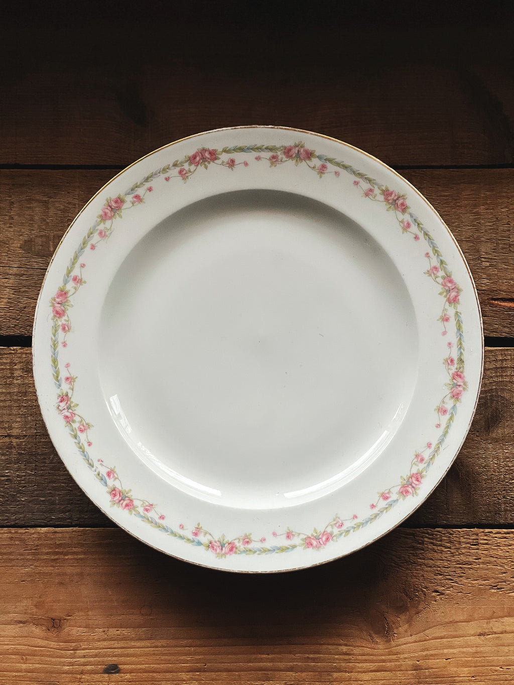 antique Limoges plate with pink floral rim