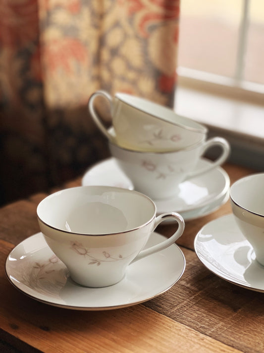 white teacups with pink roses and platinum trim