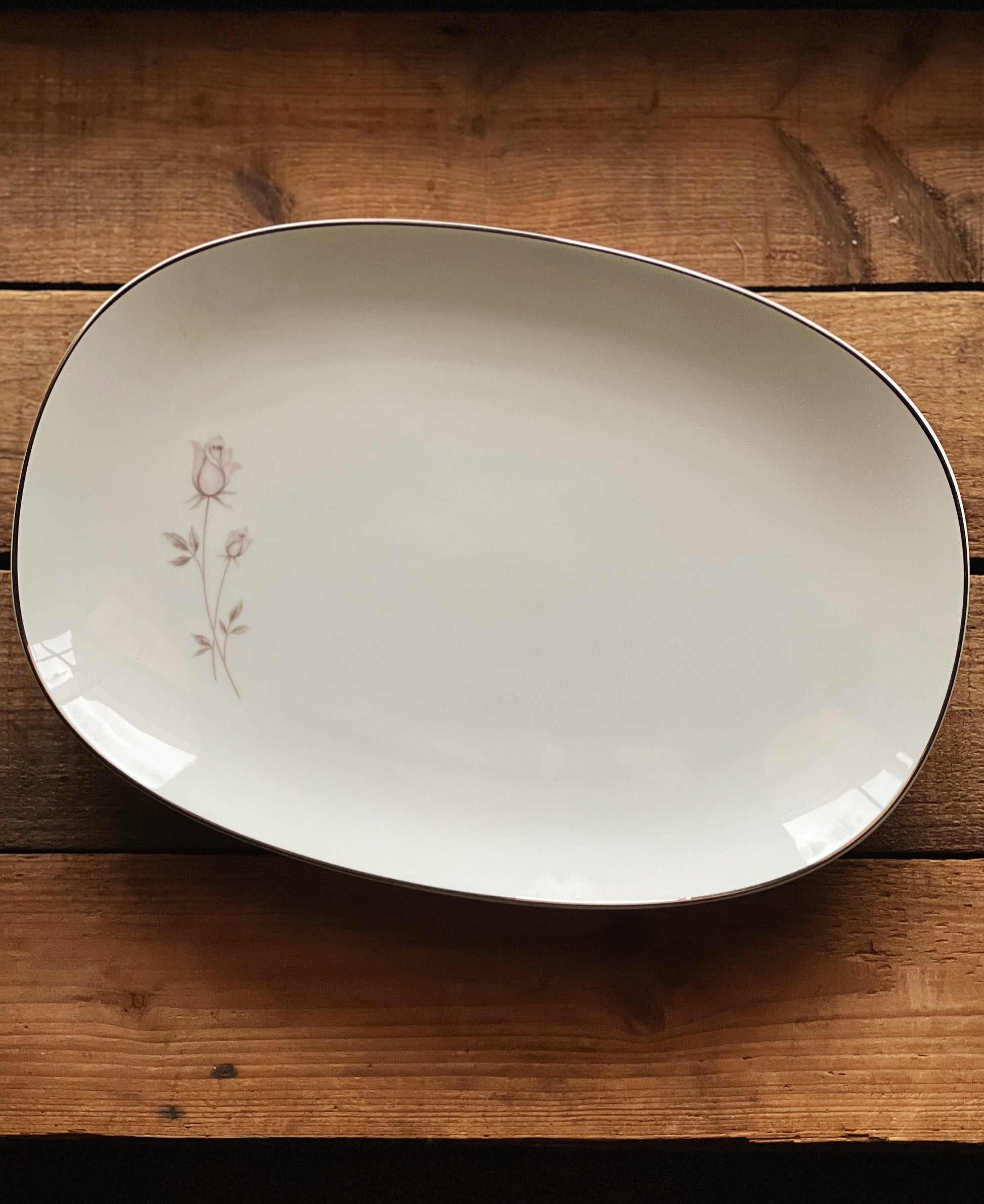 white platter with pink roses and platinum trim