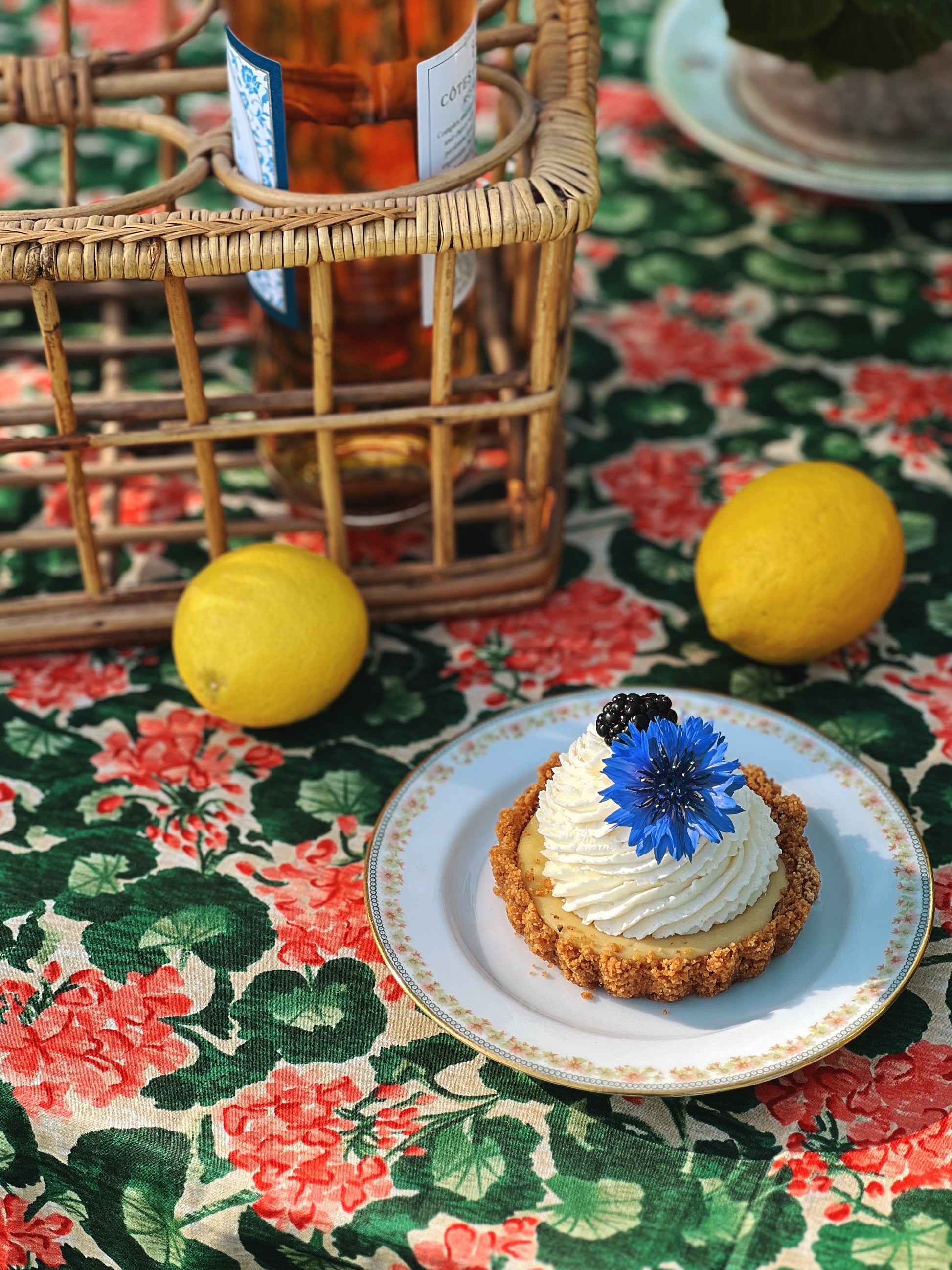 a table set with a small key lime tart on a dessert plate