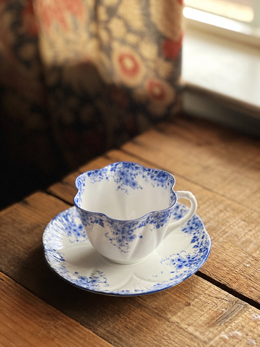 blue and white floral pattern teacup and saucer set