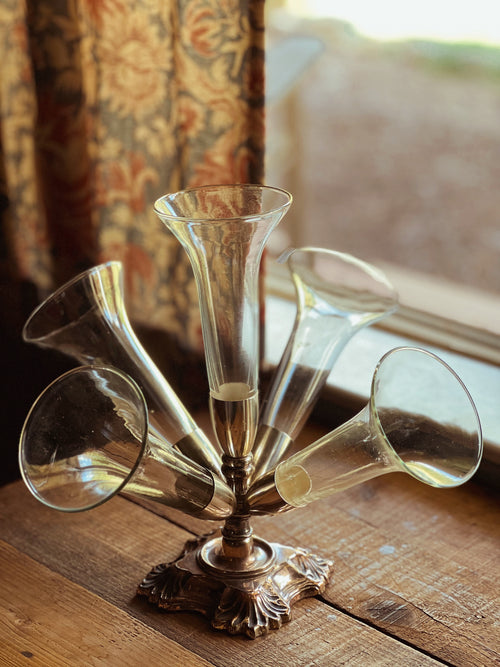 Decorative glass piece on a wooden surface with a blurred background