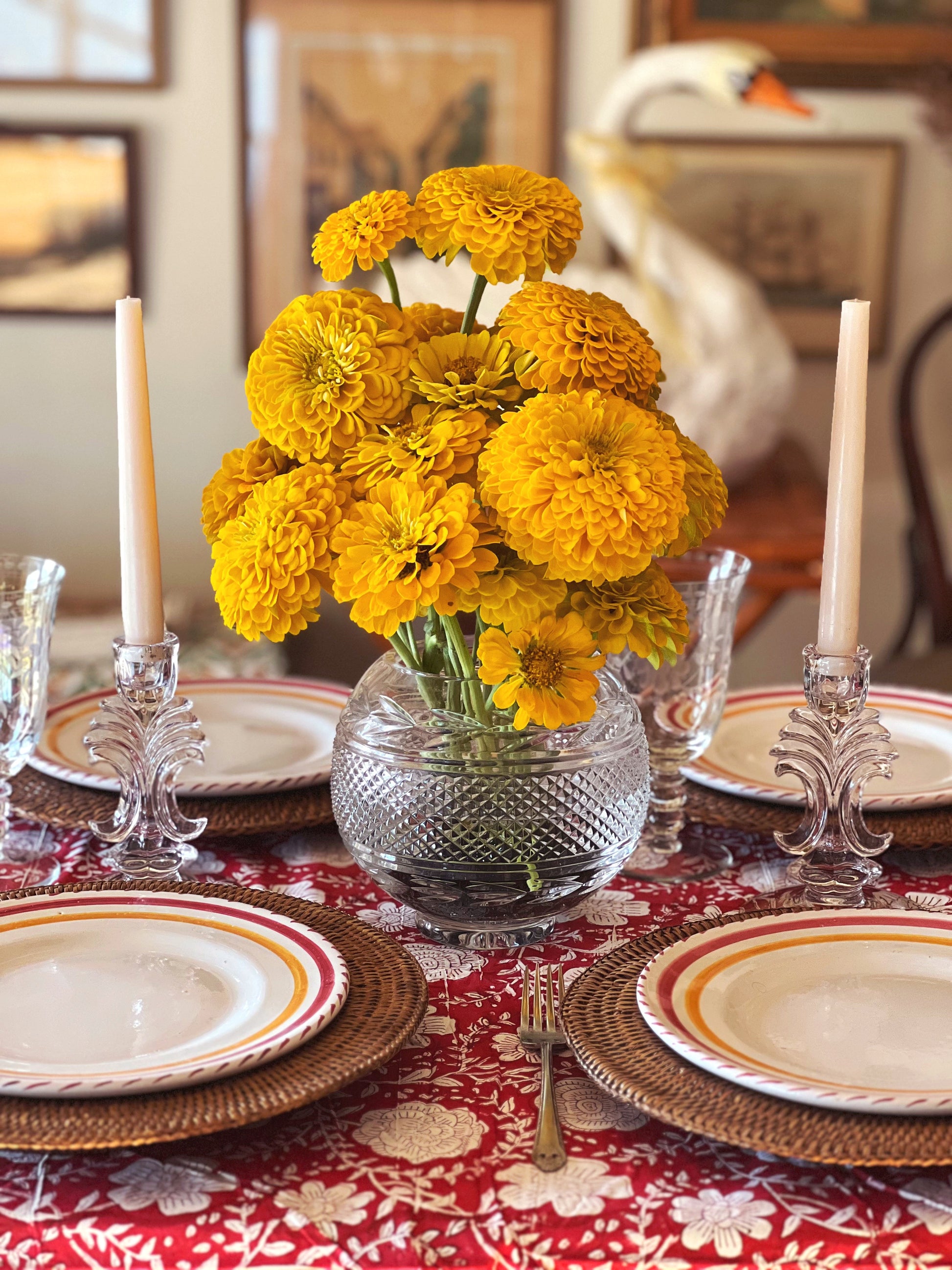 clear glass candleholders on a table set for dinner