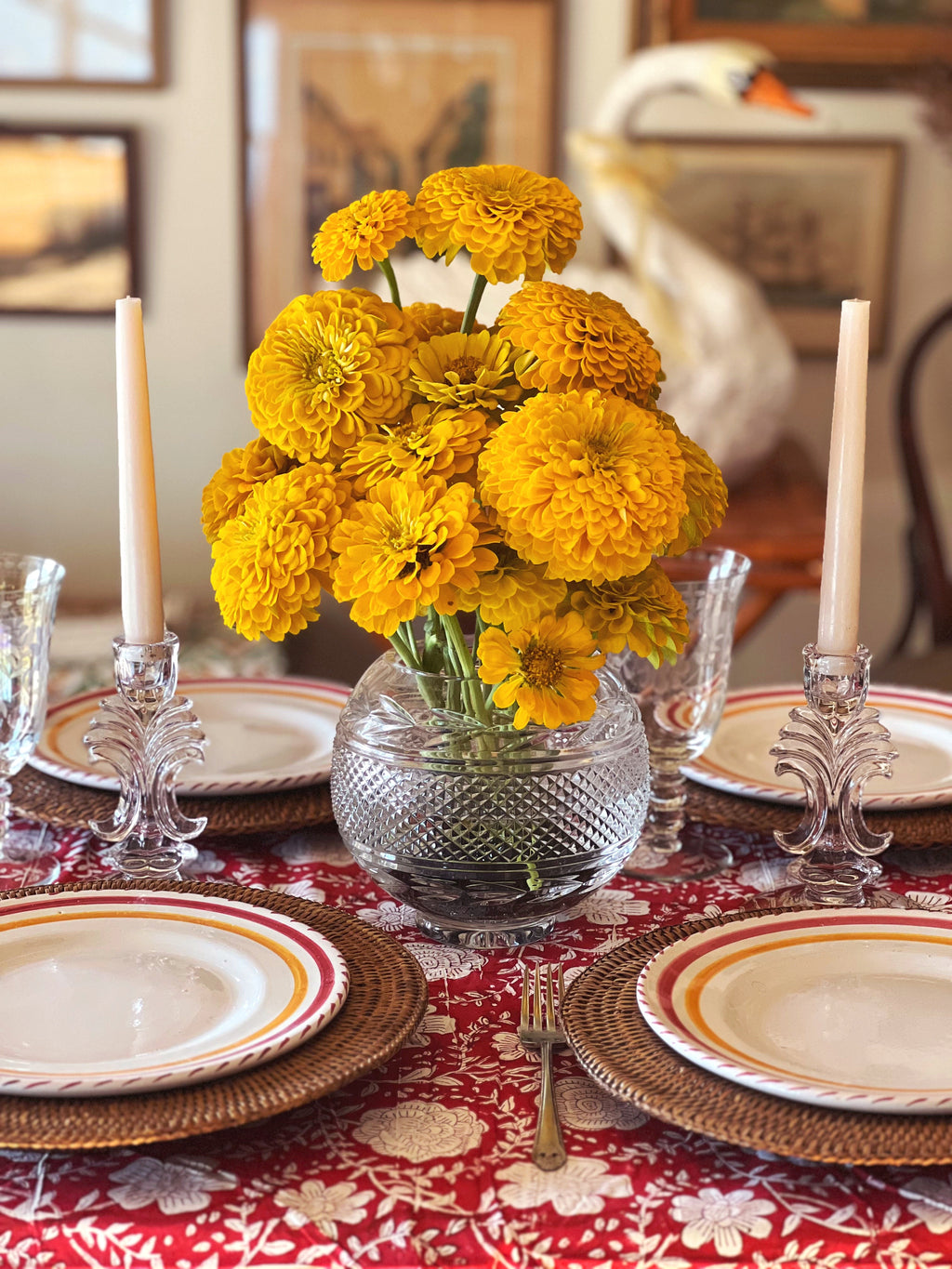 clear glass candleholders on a table set for dinner