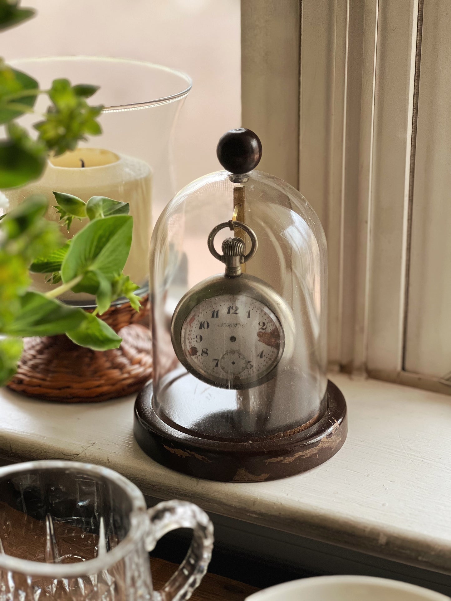 vintage silver pocket watch in cloche