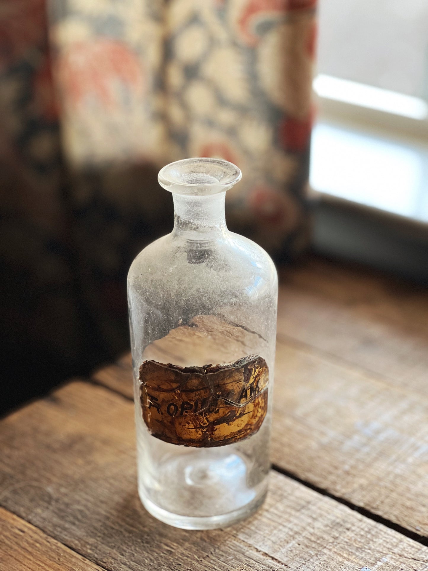 small glass apothecary bottle with no lid