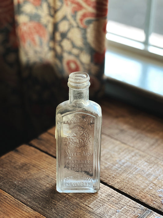 vintage Leonardo's Silver Aid medicine bottle