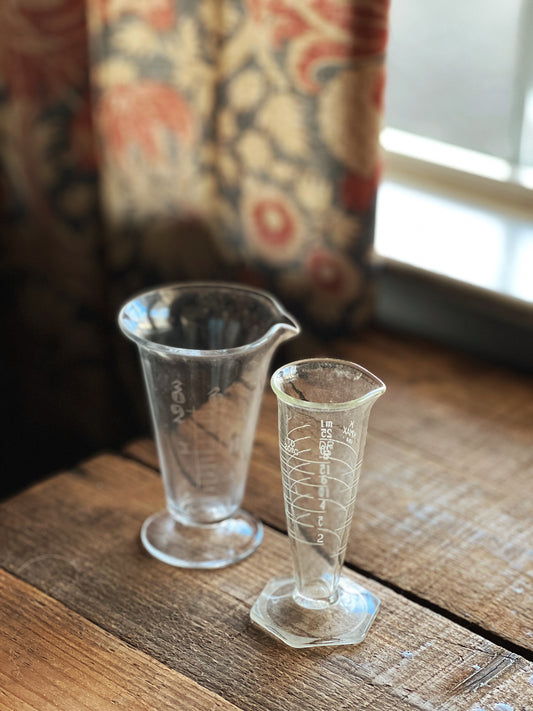 pair of glass measuring beakers