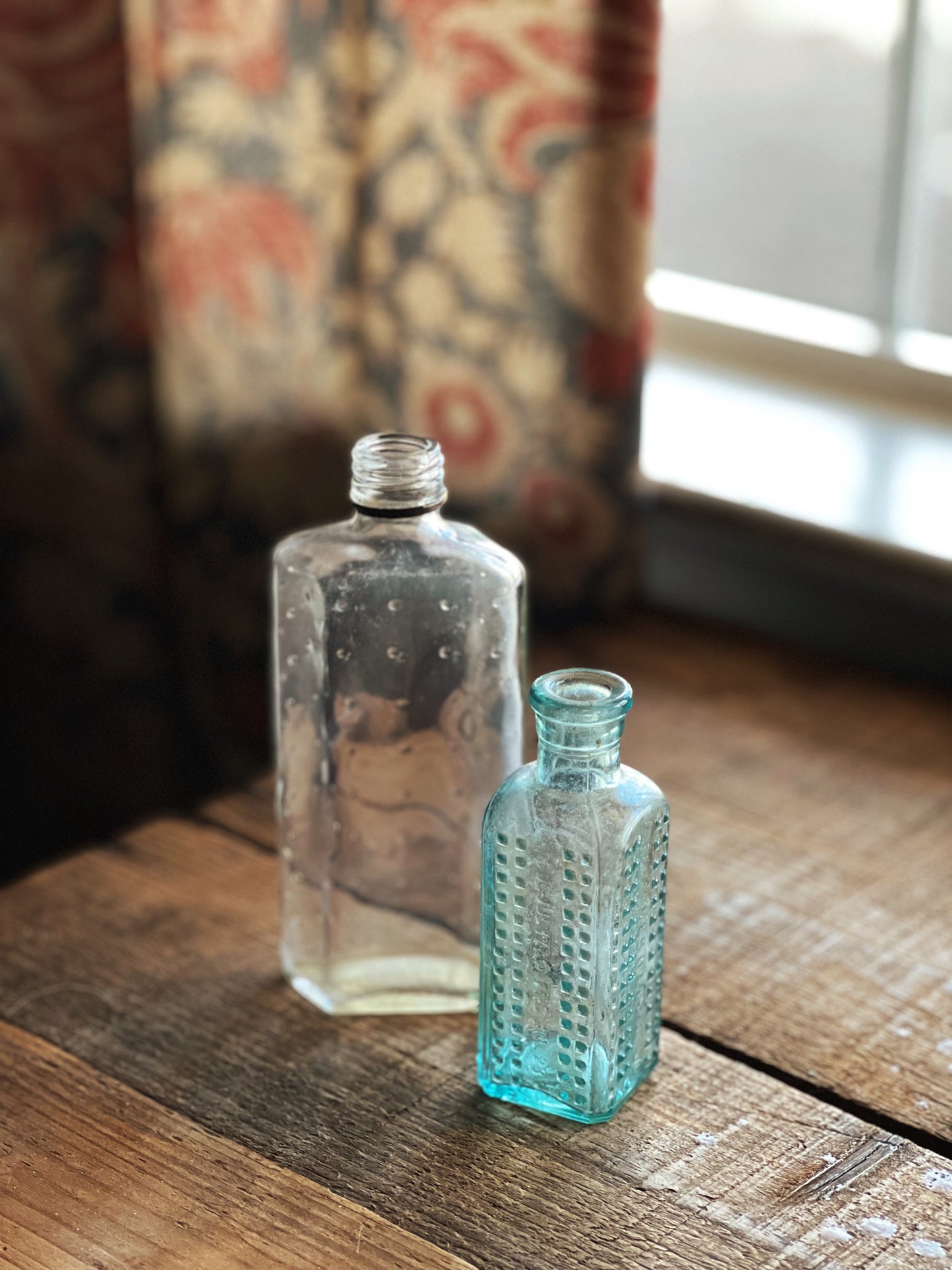 pair of vintage medicine bottle