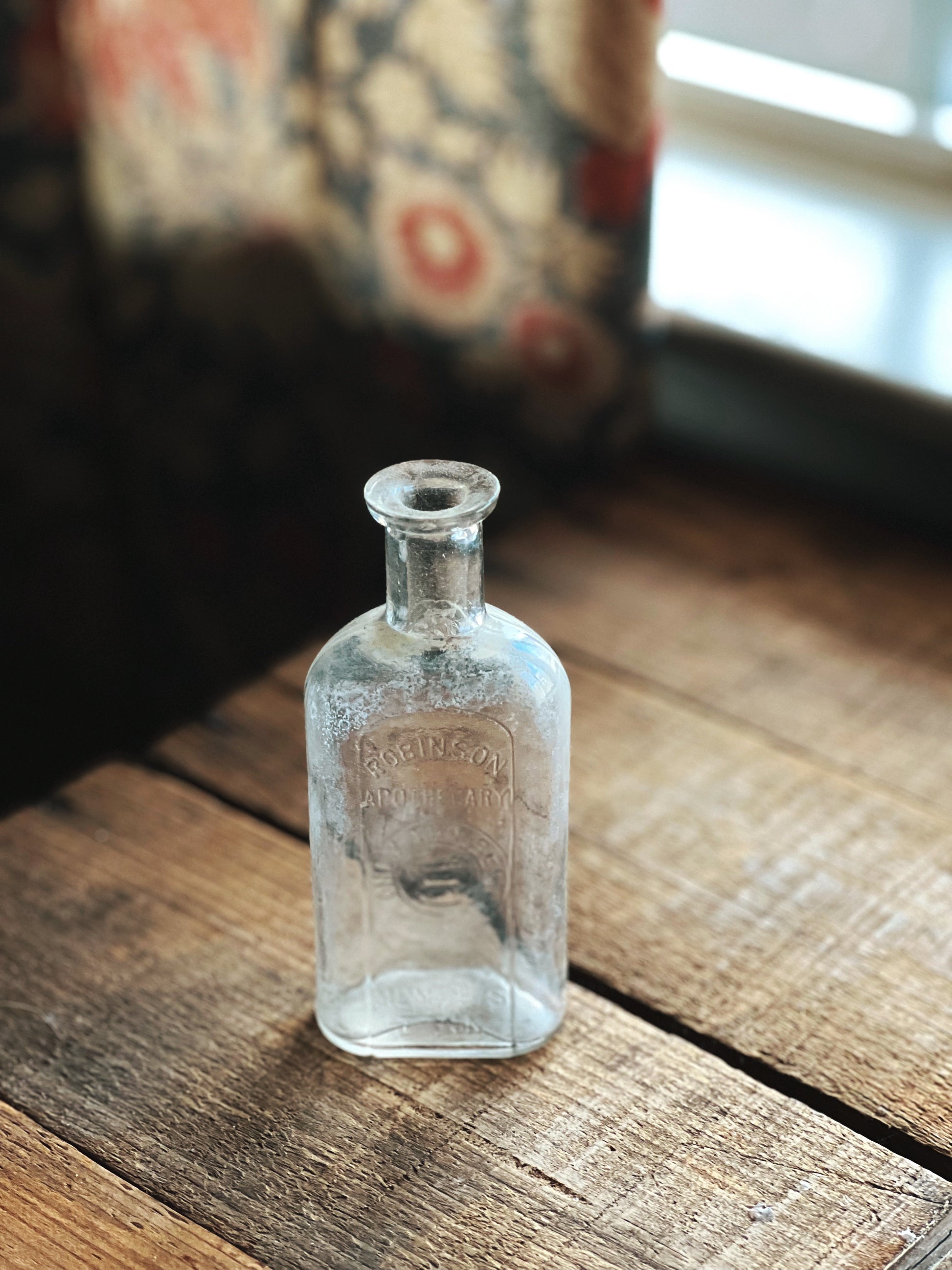 clear glass Robinson Apothecary bottle