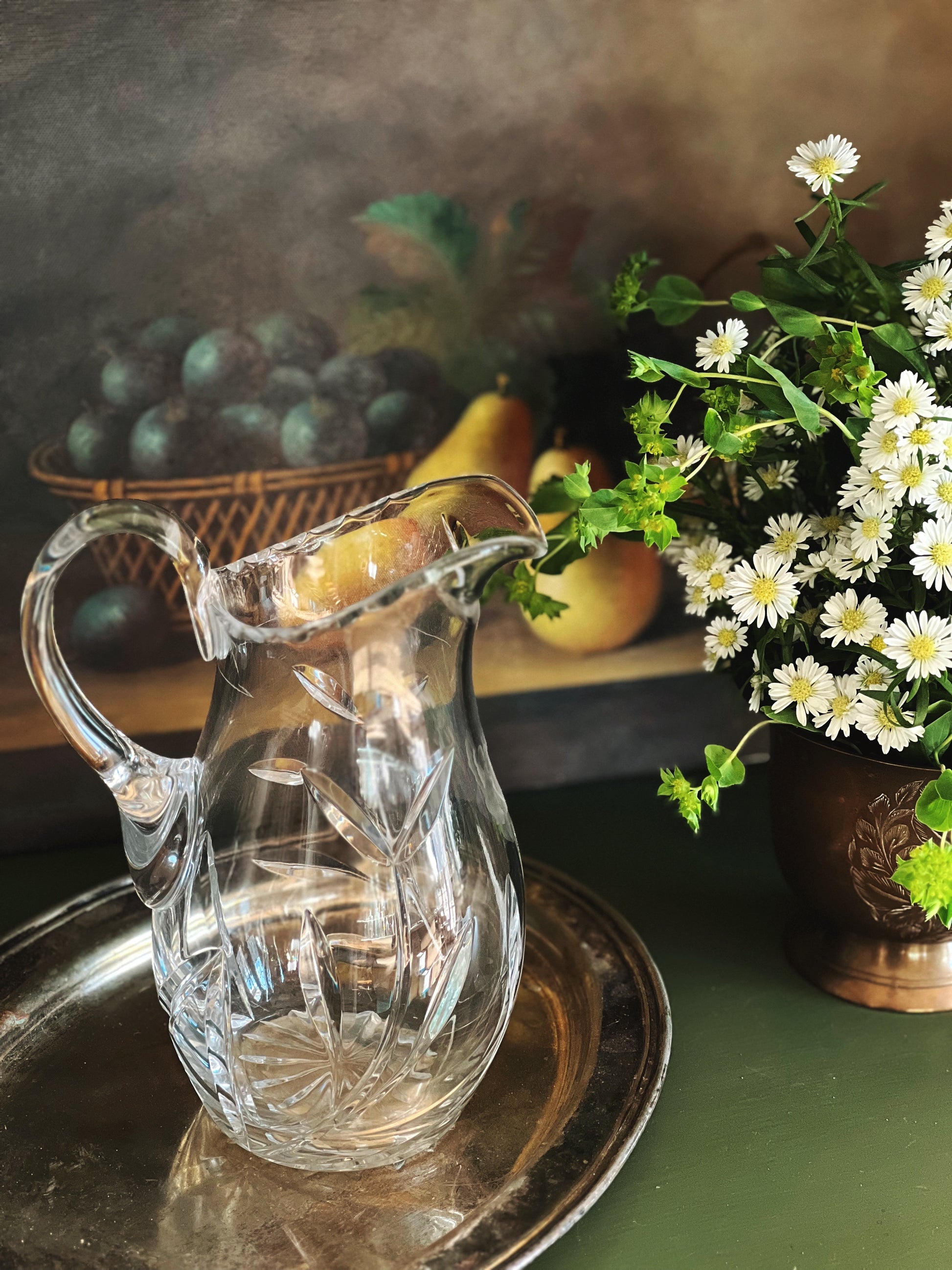 cut glass pitcher with a floral design