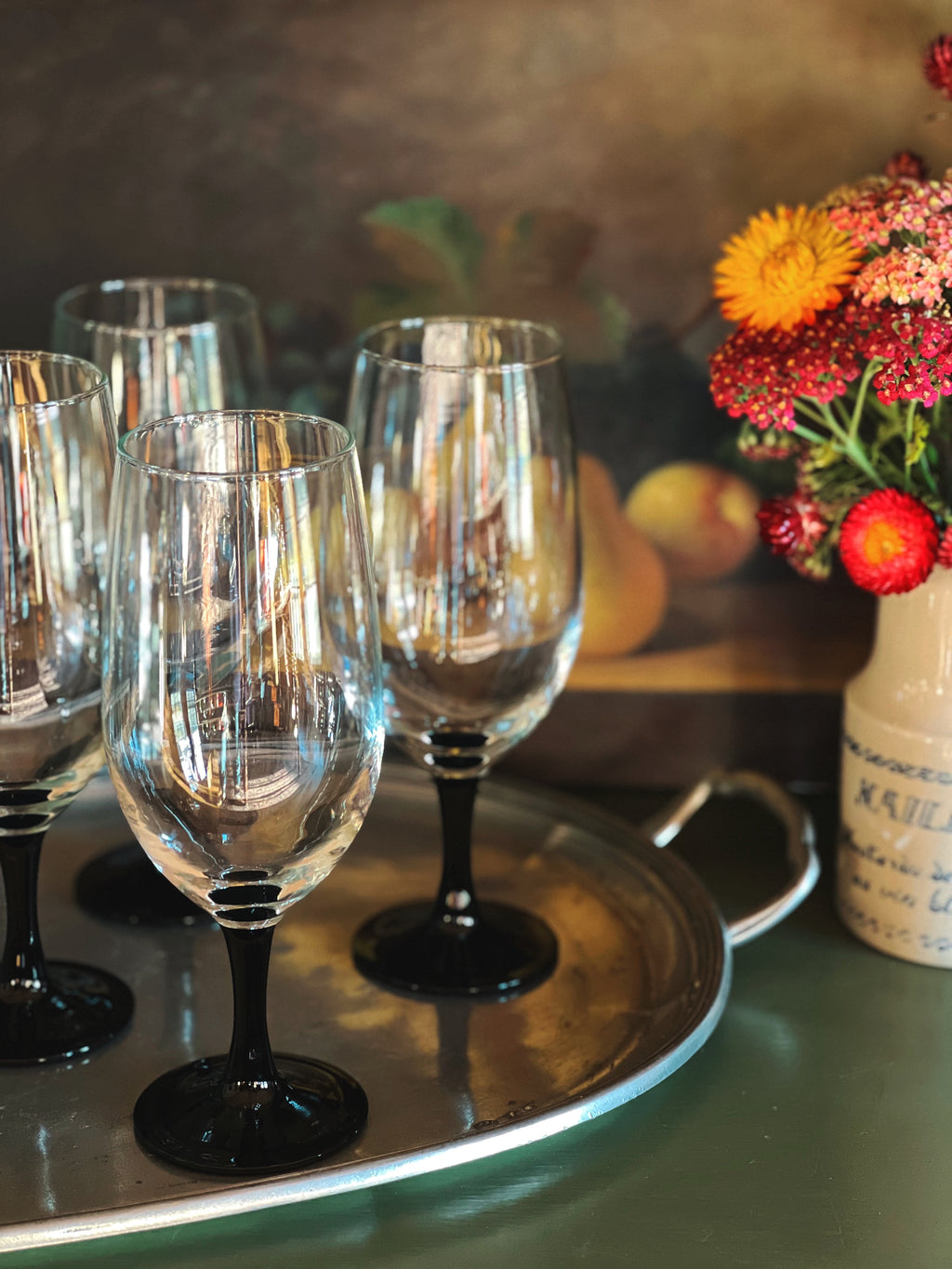 black stem French iced tea glasses on a tray 