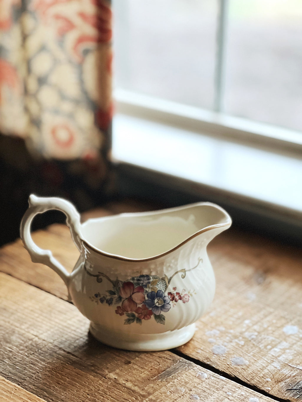 floral and garland design creamer