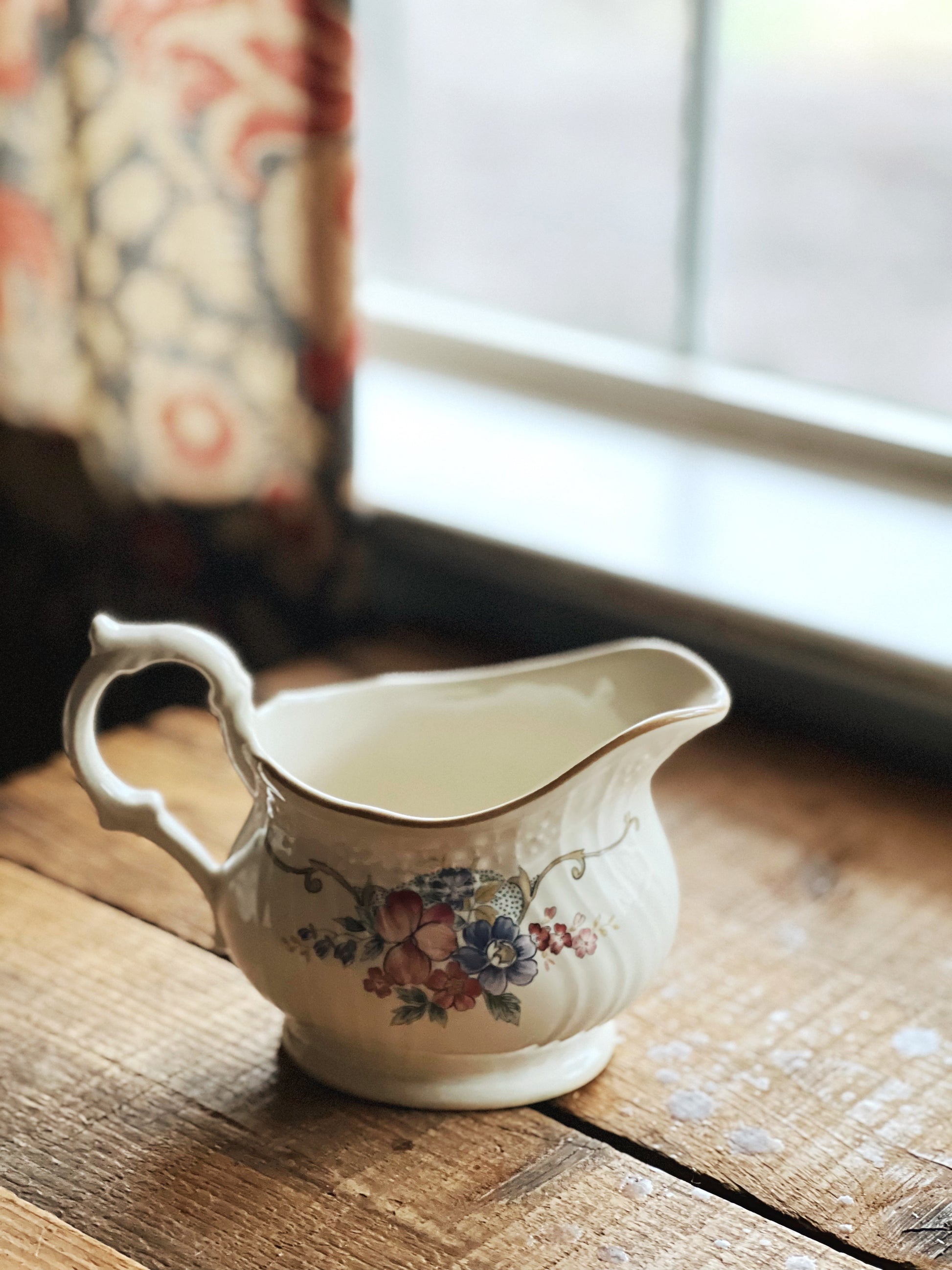 floral and garland design creamer