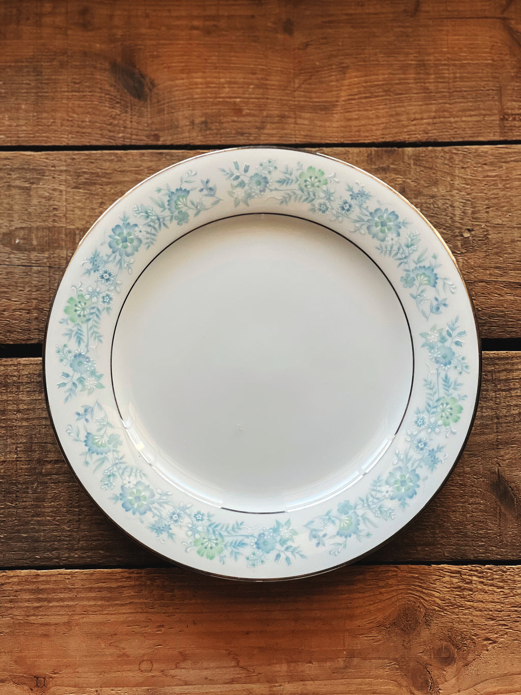 Noritake Milford salad plate with blue floral design and platinum trim