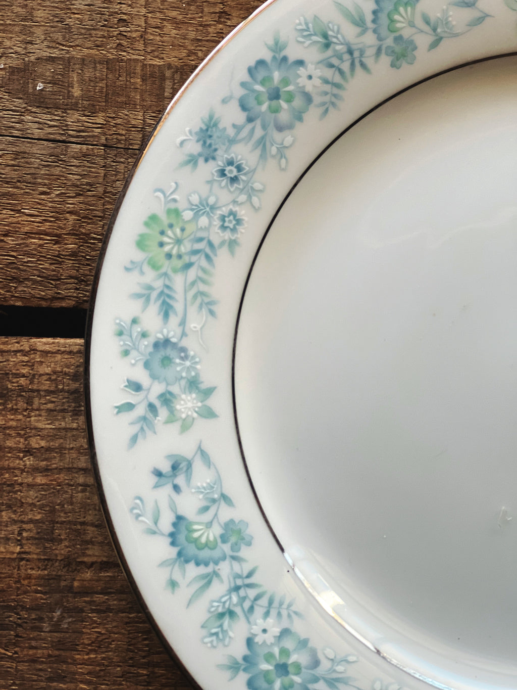 close up of blue floral design of Noritake Milford plate