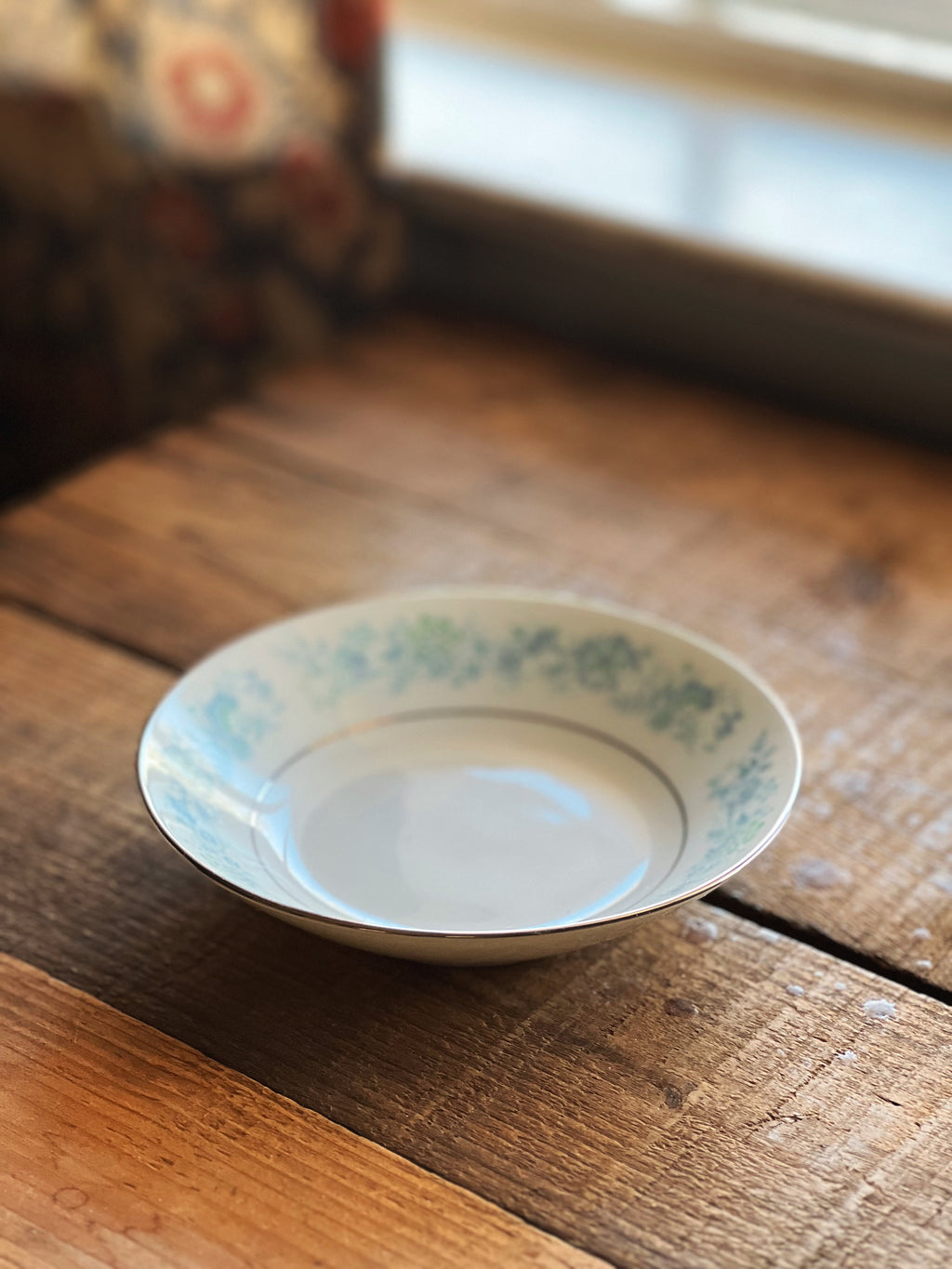 Noritake Milford berry bowl on wooden table, vintage floral china with blue pattern and platinum trim